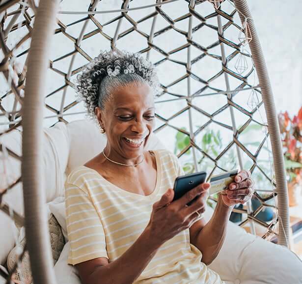 woman paying bill on phone