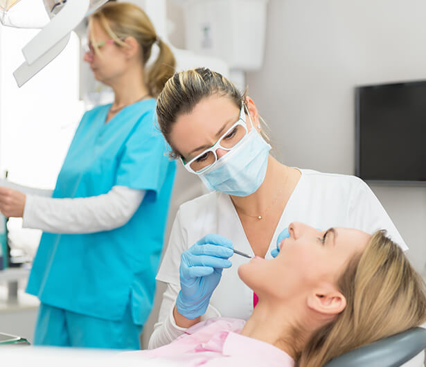 dentist examining a patient's mouth