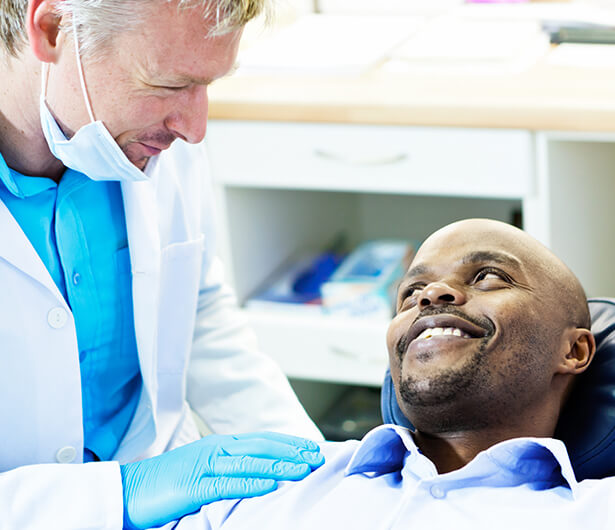 dentist comforting a patient